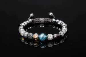Bead bracelet with blue, cognac and pave diamond beads on black, jewelry retouching